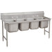 A stainless steel Advance Tabco four compartment pot sink.