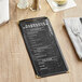 A black Choice menu cover on a table.