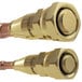 A close-up of brass threaded connectors with a gold finish on one end and a copper finish on the other.