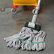 A Unger SmartColor green microfiber tube mop head on a mop handle.