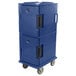 A navy blue plastic Cambro Ultra Camcart food pan carrier with wheels and a black handle.