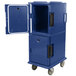A navy blue plastic Cambro food pan carrier with wheels and a door open.