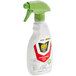 A white SC Johnson Raid Essentials spray bottle with a red and white label and a green handle.