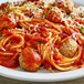 A plate of spaghetti with meatballs and Prego traditional Italian sauce.