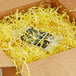 A package with Spring-Fill Canary Radiance Crinkle Cut Paper Shred inside.
