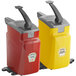 Two red and yellow plastic Heinz countertop pump dispensers with black handles.