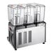 A Carnival King refrigerated beverage dispenser with three clear containers.