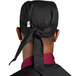 A black Uncommon Chef skull cap with ties.