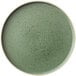A smoky basil green Oneida Moira stoneware plate with specks.