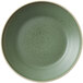 A smoky basil stoneware deep plate with speckled dots on it.