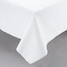 A white Intedge vinyl tablecloth on a table.