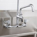 An Equip by T&S add-on faucet on a stainless steel sink.
