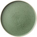 A smoky basil green stoneware plate with specks.