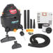 A close-up of a Shop-Vac wet/dry vacuum with accessories and tools.