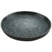 A black cheforward melamine plate with speckled specks on the surface.