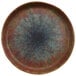A cheforward round brown melamine plate with a blue and brown speckled design.