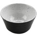 A close up of a black and white cheforward ramekin with a speckled design.