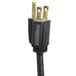 A black electrical plug with gold tips.
