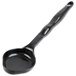 A black plastic Vollrath High Heat Solid Oval Nylon Spoodle with a handle.