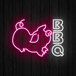 A Canvas Freaks neon sign with the word "BBQ" in neon pink and white with a neon pig.