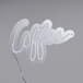 A white neon sign that says "Coffee" on it.
