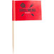 A small red rectangular flag with black text reading "Grill Menu" on a wooden stick.