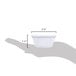 A hand holding a white fluted melamine ramekin with measurements.