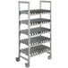 A white metal Cambro Camshelving drying rack with shelves.