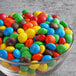 A bowl of colorful M&M's Peanut Butter candies.