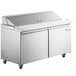 A stainless steel Avantco sandwich prep table with two doors and a cutting board top.