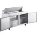 An Avantco stainless steel refrigerated sandwich prep table with open doors.