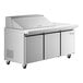 An Avantco stainless steel refrigerated sandwich prep table with three doors on wheels.