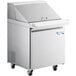 An Avantco stainless steel refrigerated sandwich prep table with wheels.
