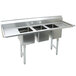A stainless steel Advance Tabco convenience store sink with three compartments and two drainboards.