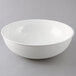 A white bowl on a gray background.