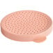 A pink circular plastic lid with holes for a cheese or sugar shaker.