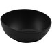A dark gray irregular round matte melamine bowl.