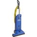 A blue Clarke CarpetMaster 218 vacuum cleaner with yellow tubes.