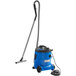 A blue Nilfisk wet/dry vacuum with a hose and cord.