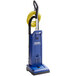 A blue Clarke CarpetMaster 212 vacuum cleaner with a yellow tube.