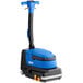 A blue and black Clarke MA30 walk behind floor scrubber with wheels.