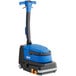 A blue and black Clarke MA30 walk behind cylindrical floor scrubber with wheels.