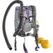 A ProTeam GoFit backpack vacuum with a hose attached.