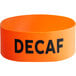 An orange silicone label band that says "Decaf" on a coffee airpot.