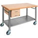 A John Boos maple kitchen cart with drawers and an undershelf on wheels.