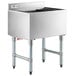 A Regency stainless steel underbar ice bin with cold plate and bottle holders on a counter.