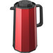 A red Zojirushi coffee carafe with a black push-button stopper.