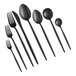 A close-up of several Acopa Odin black stainless steel demitasse spoons.