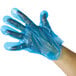 A hand wearing a blue biodegradable AeroGlove.