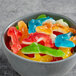 A bowl of Vidal assorted color gummy sharks.